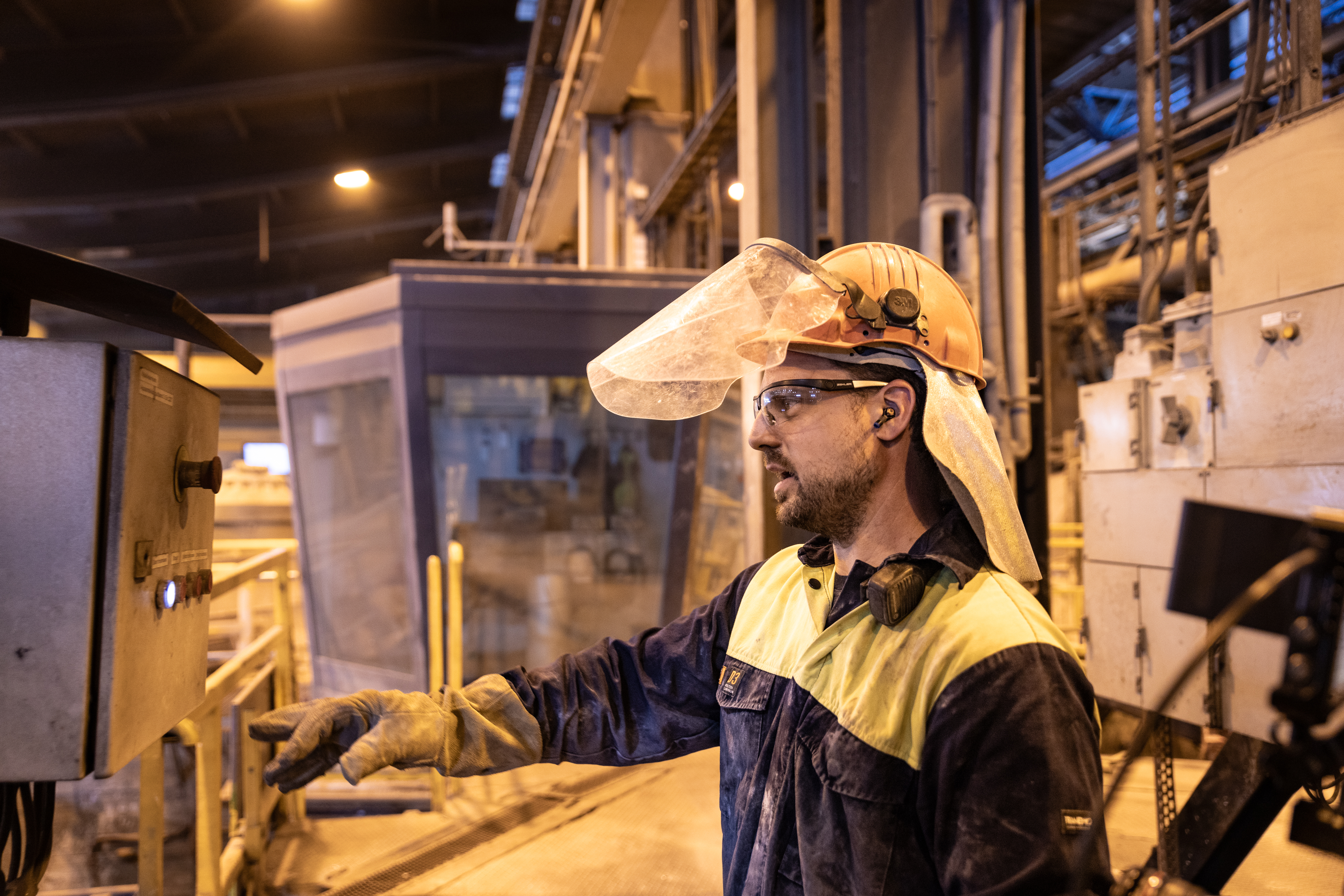 Oskar Rundberg, operator at Oskar Rundberg, operator at Stena Aluiminium’s smelter, dressed in hi-vis protective gear, standing in the smelter, shows the process of recycling aluminium.Stena Aluiminium’s smelter, dressed in hi-vis protective gear, standing in the facility where aluminium ingots are stored.