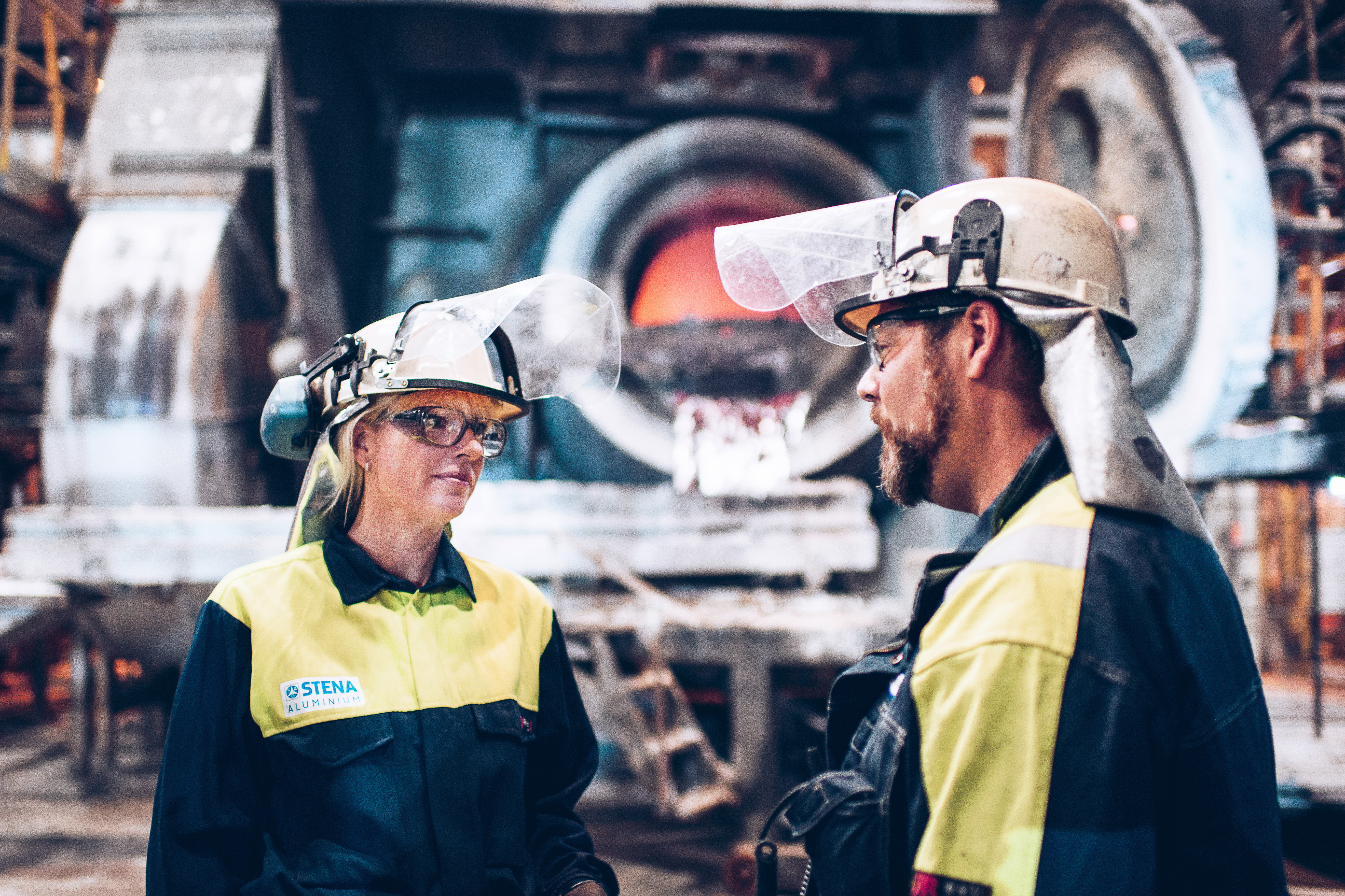Two Stena Aluminium employees talking