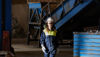 A Stena Aluminium employee walking through the production environment