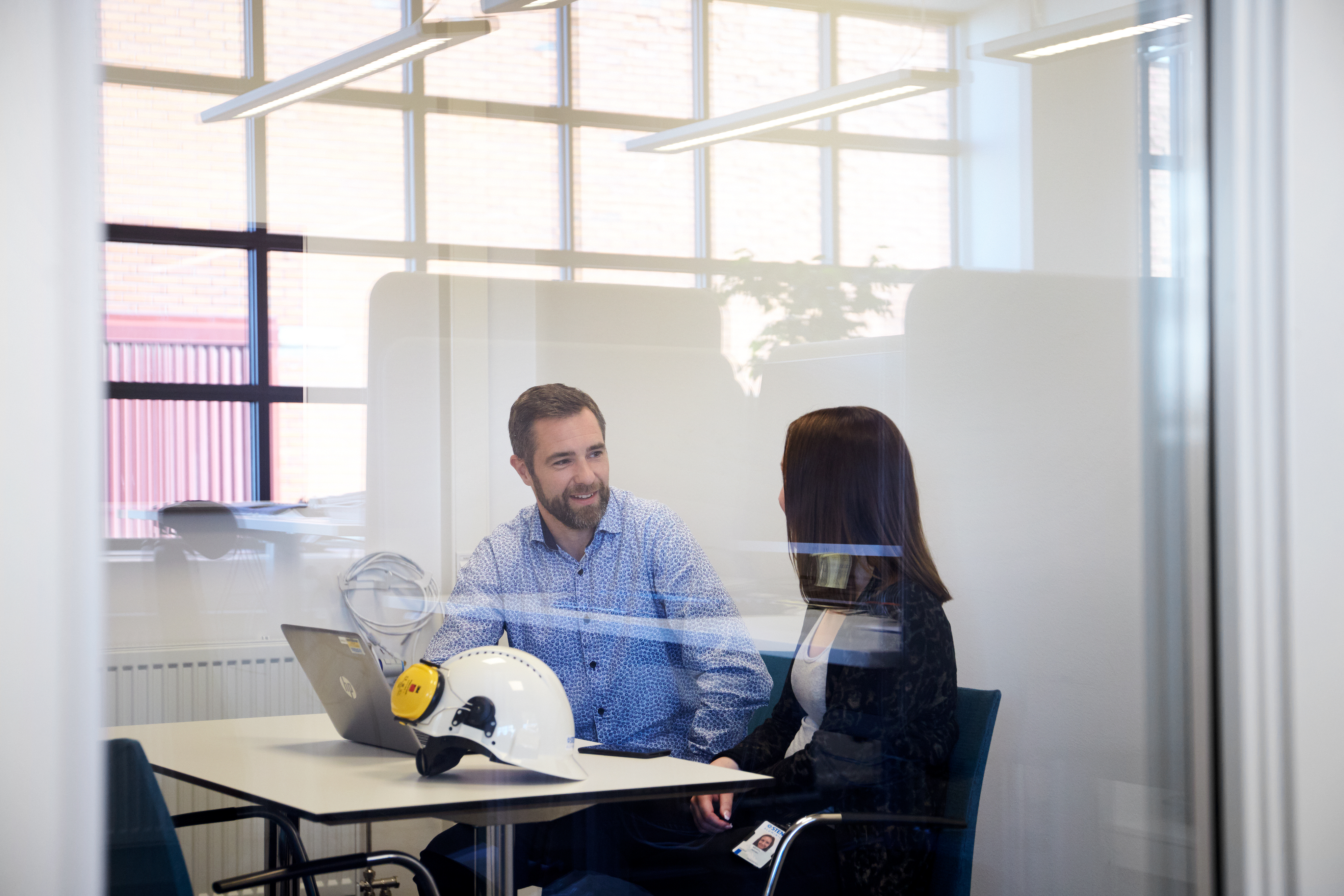 A Stena Aluminium employee discussing business with a customer
